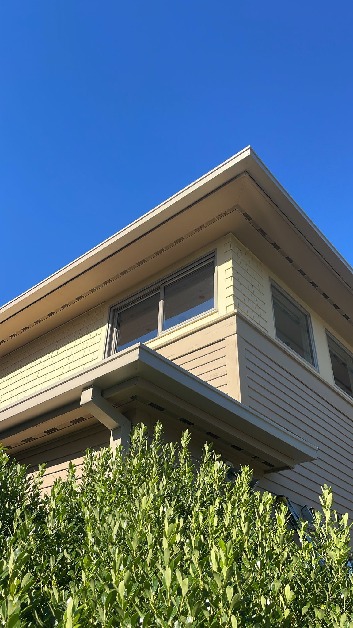 Seamless gutter installation on residential home